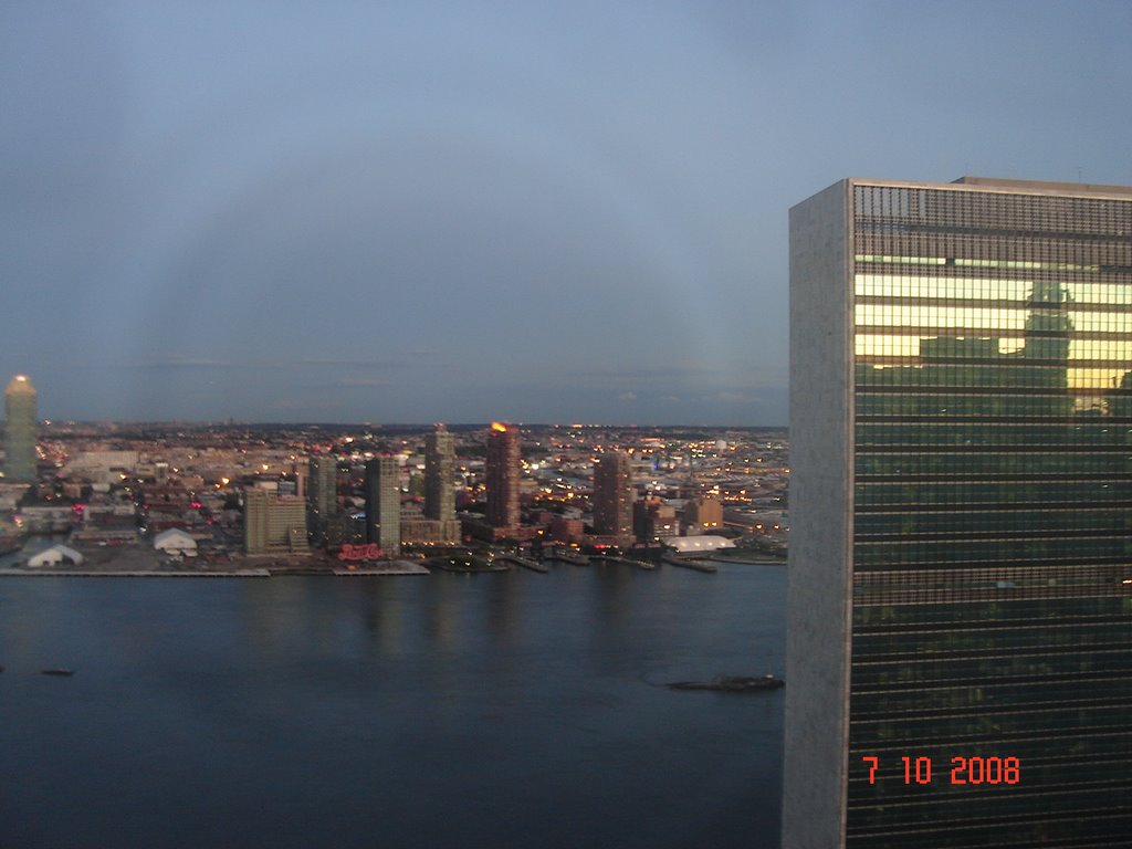 View on Queens, East River and UN Building from Millennium Hotel at sundown by Anuar T