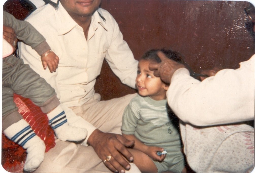 Indian Hindu Rite, Mundan Sanskar, Vaibhav in 1985 at Shitla Mata Mandir, Doonga Hanuman, Guru Bazar, Amritsar chopping hairs by Parbodh C Bali