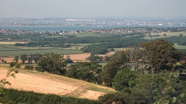 View From Brading towards the Solent and the main land. by Pickers