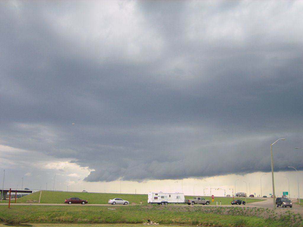 A Dark, Ominous Wall Cloud Starts to Build on the Plains in South Red Deer, AB by David Cure-Hryciuk