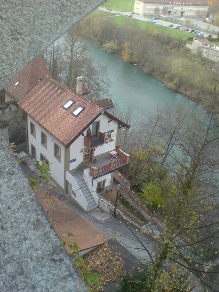 A house under the bridge by Wam Kat