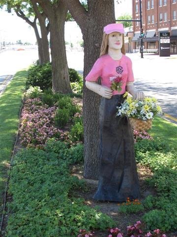 Flower Lady; life-sized carved wood, Wichita,KS by Maxine Arnoldy