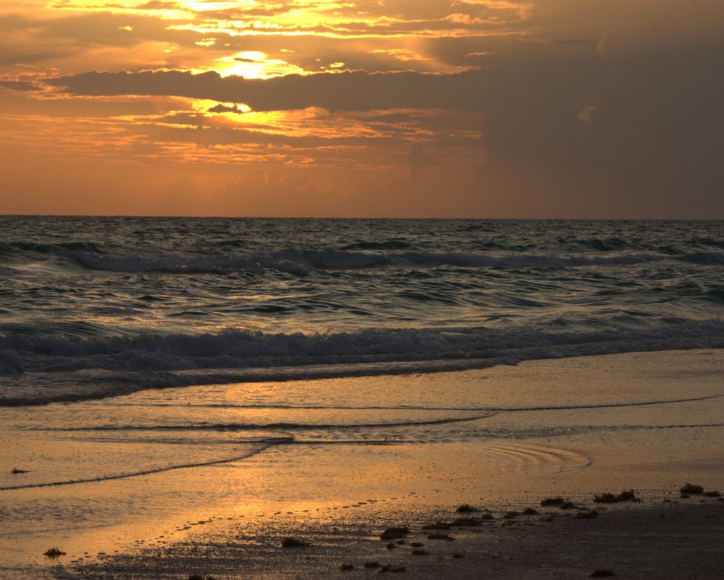 Gulf sunset with rain to the north. by MacForester