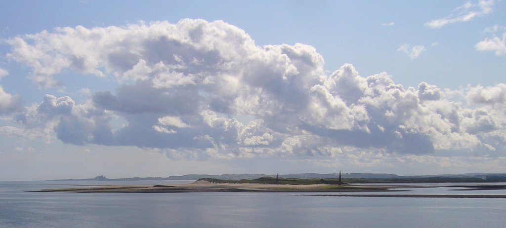 View from Holy island looking south towards Bamburgh Castle. by Vince Byrne