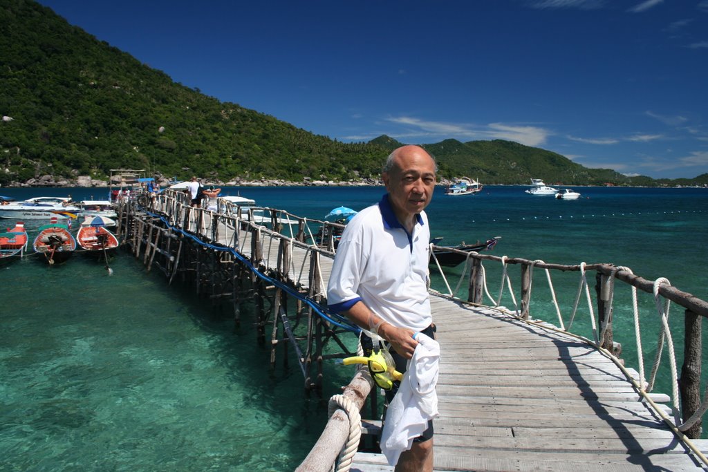 Man on jetty by zak idrus