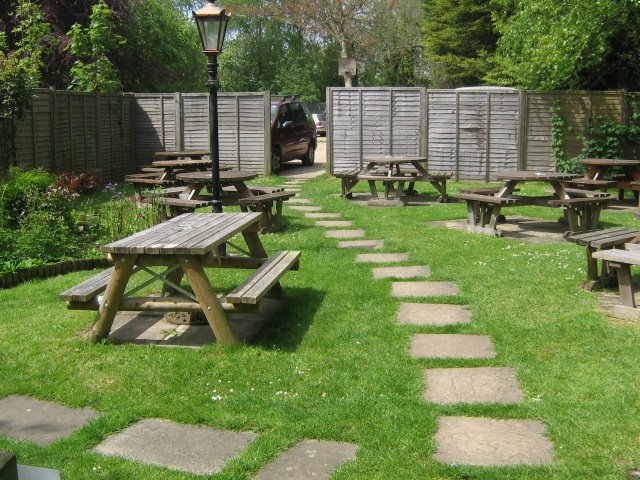 The few sets of wooden tables, tucked round the Bush Inn by Robert'sGoogleEarthPictures