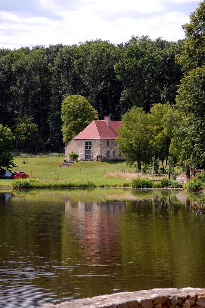 A cottage reflecting in the lake at Troncais, France by © Andre Speek