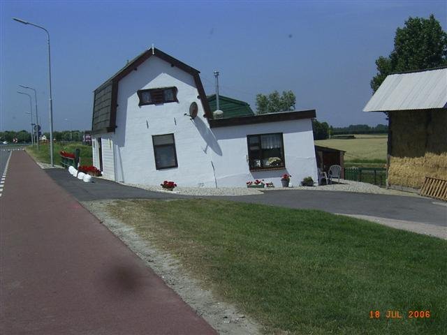 House on a dutch dike near Kaagdorp by Janwillem van goor