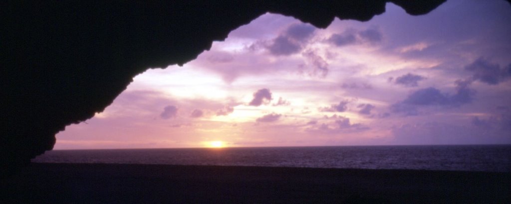 Sunset from the cave on Kalalau Beach by Dusty Trail