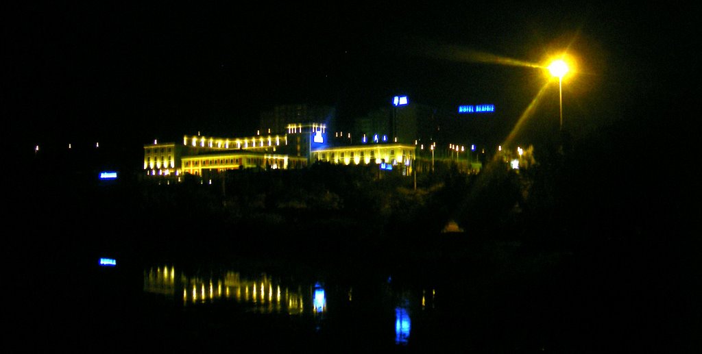 Hilton Hotel and its reflection in the Tajo River at night. by Spiritualized Kaos