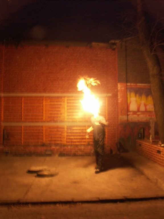 Fire games in front of Pub "Mleczarnia" (april 2005) by Paweł “Widget SFOR” …