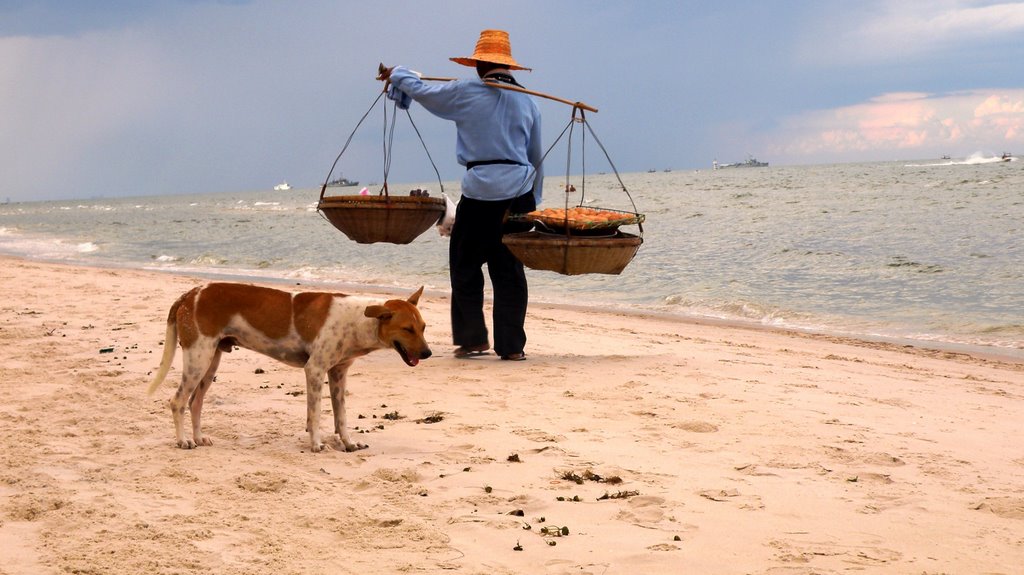 Beach vendor and stray dog by Adam Sichta