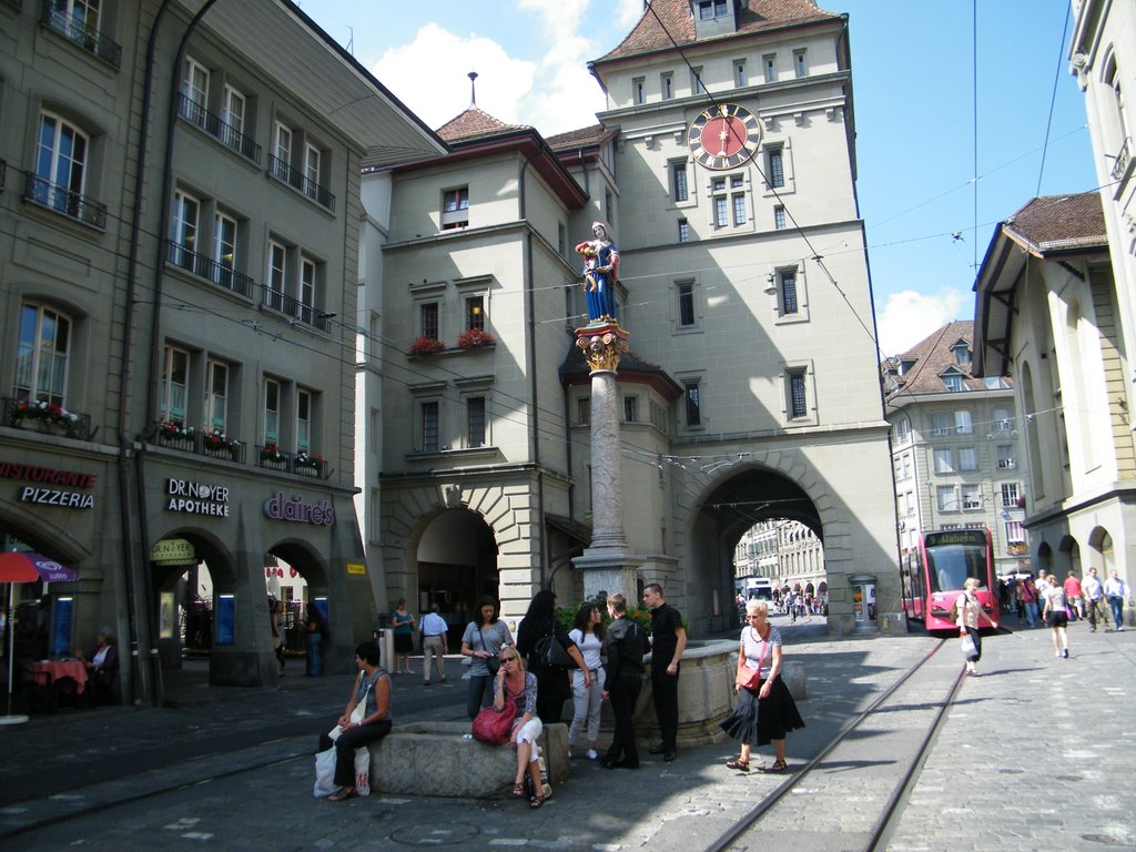 Anna-Seiler-Brunnen with Kafigturm in the background - Bern by Flavius Patruti