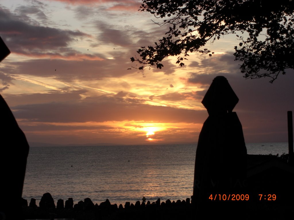 Sunrise over port talbot from oxwich by the river god