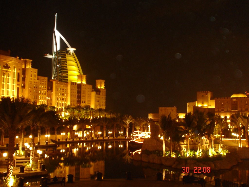 Burj al Arab over the city by night, Dubai by Youssef Haddad