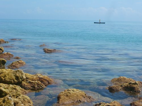 Fishing in a canoe in the keys by Mike  Krebs