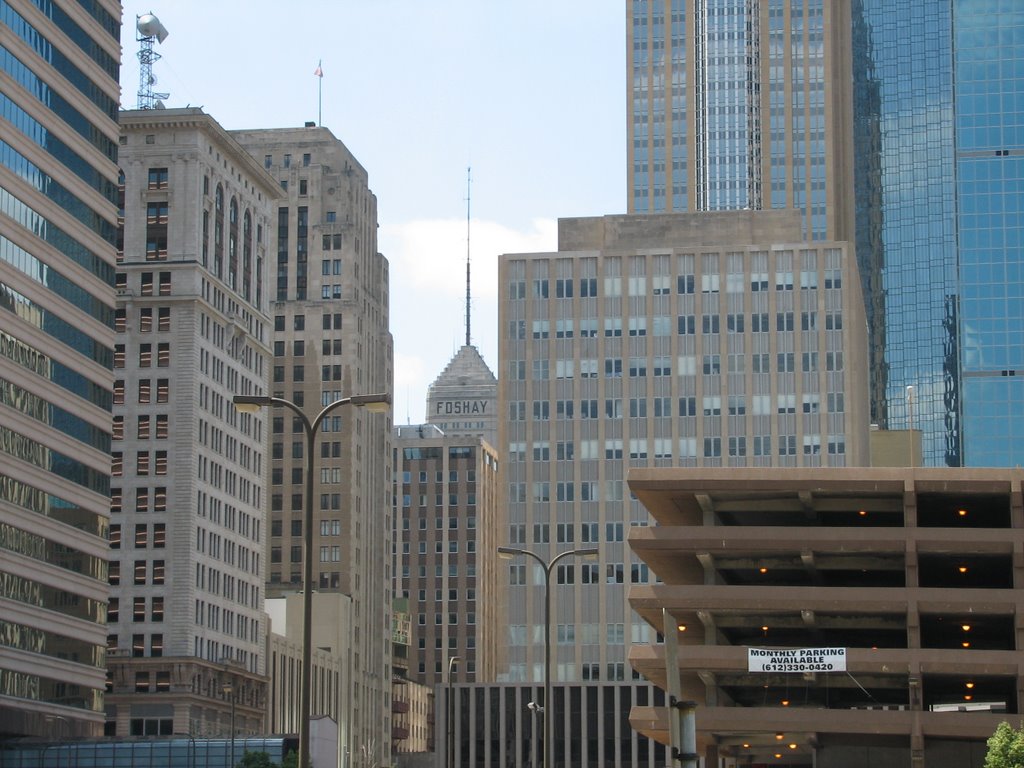 Foshay Tower seen between other buildings by Cadwaladr