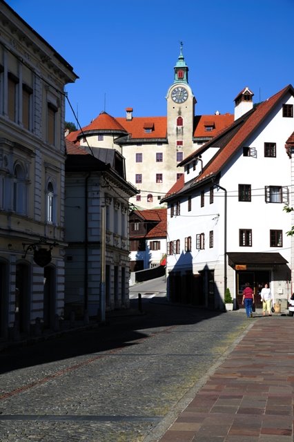 Street and castle in Idrija by Samo Trebizan