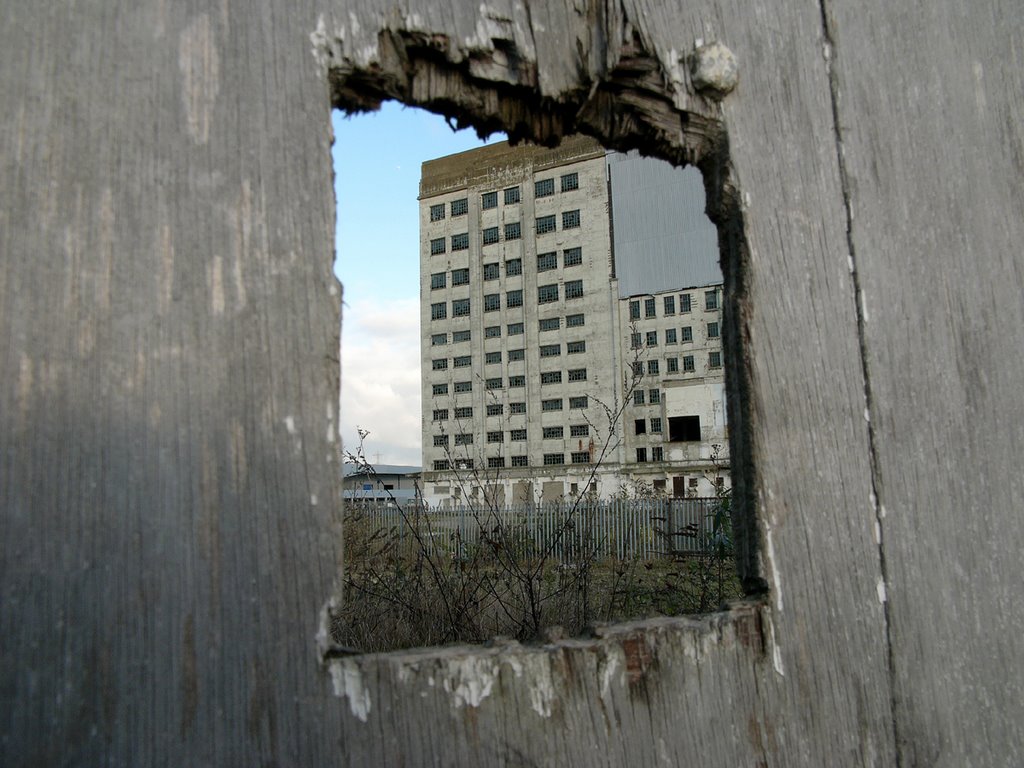 Mill through hole in fence by chazola