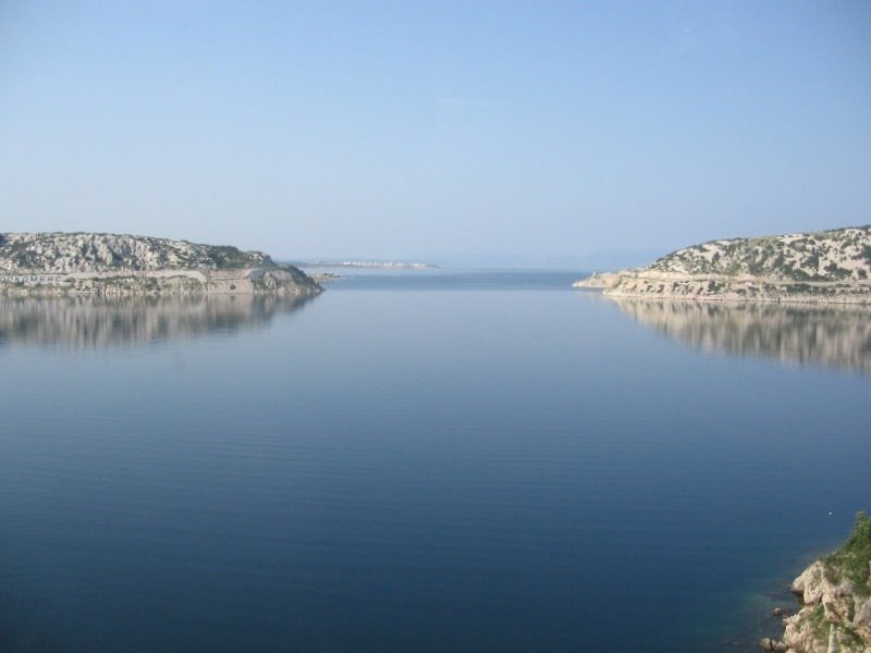 Senjska vrata. Krk island on the right. by Sergey Briskin