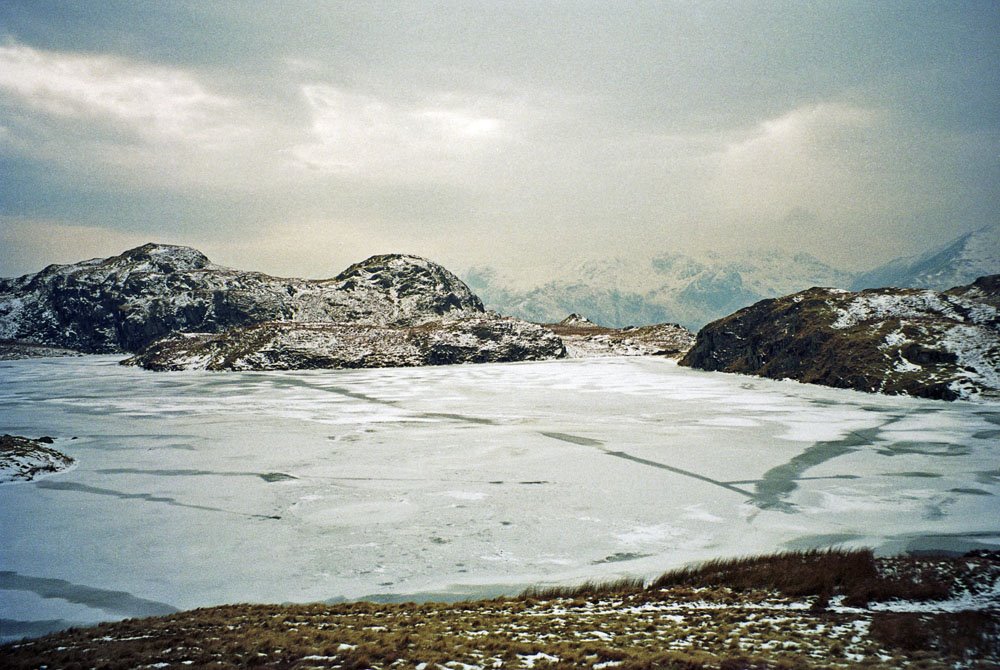 Looking West over a frozen Angle Tarn (February 1994) by pedrocut