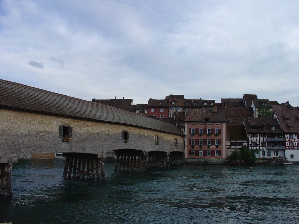 Old wooden bridge seen from German shore of Rhine by ruedi_w