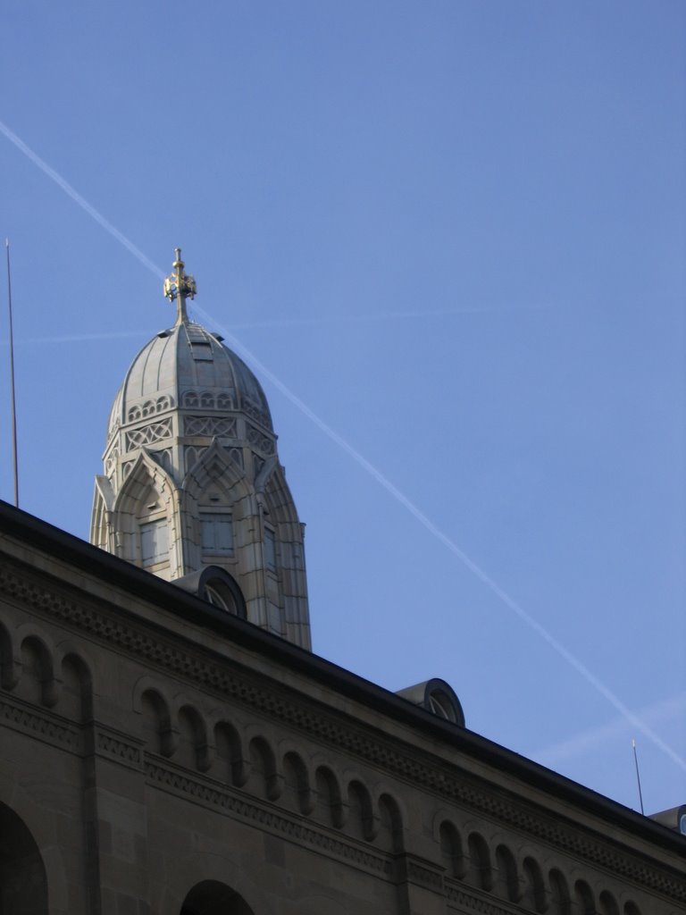 A sign in the sky at a church in Zurich by Albertoiquique