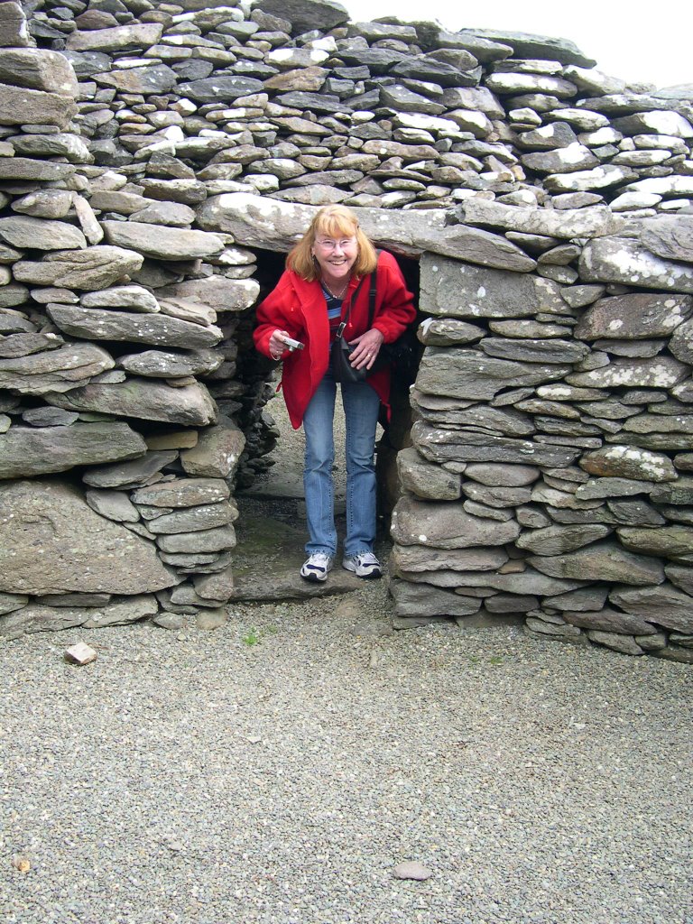 Máire in doorway Beehive house Dingle by VW