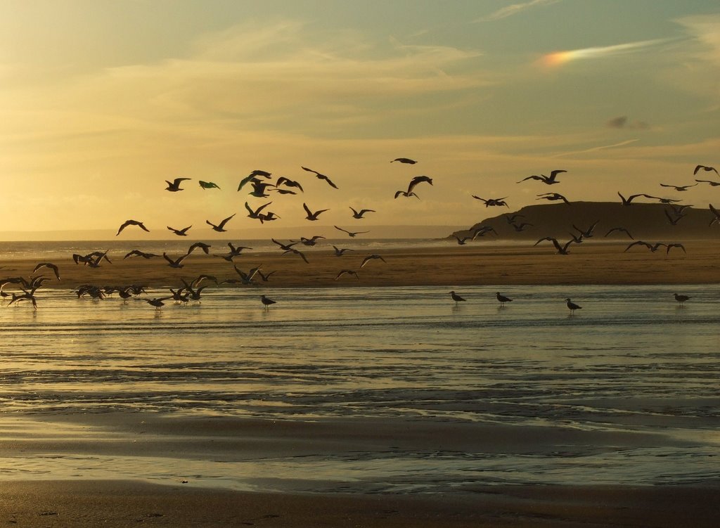 Rhossili beach, on the sky phenomenon called "sun dog",Wales, UK by Slawomir Purzycki