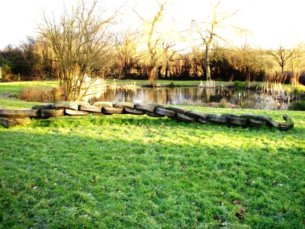 Carving in front of Capel village Pond by Gordon Abben