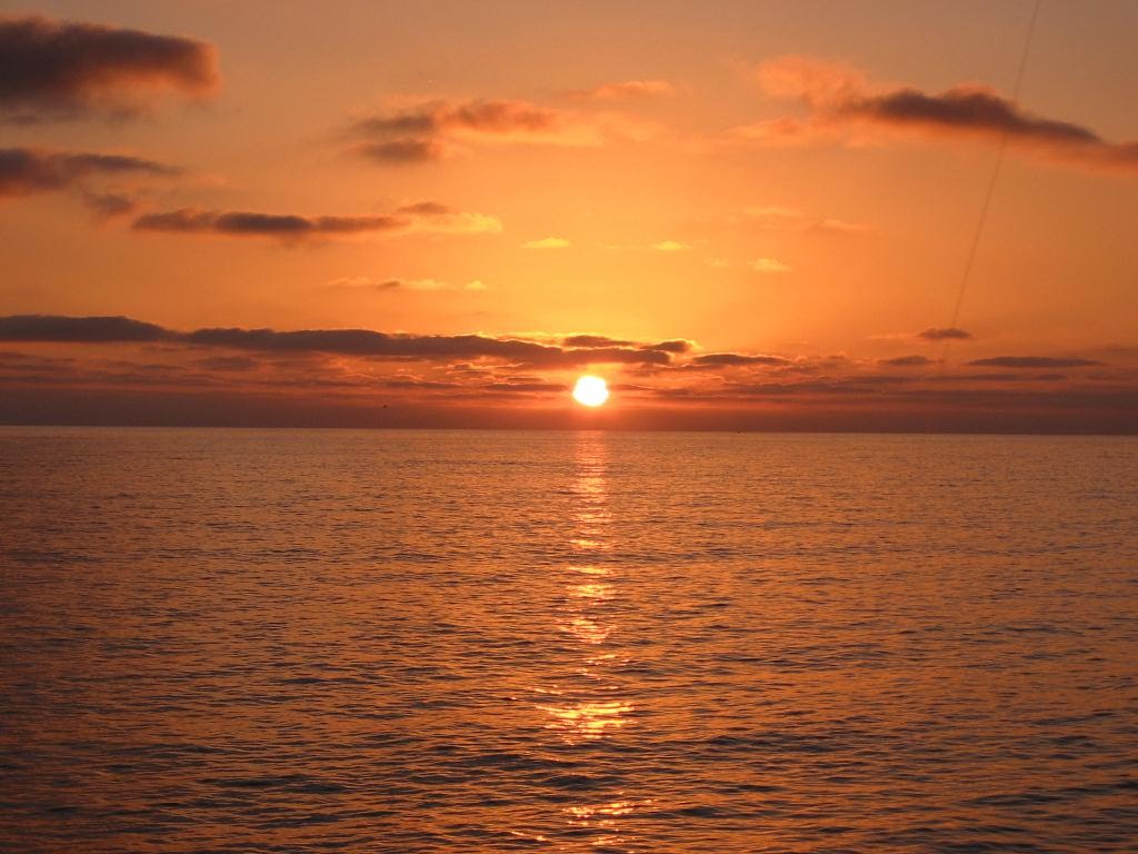 The Sun Sets Over the Ocean in Oceanside, CA by skibum415