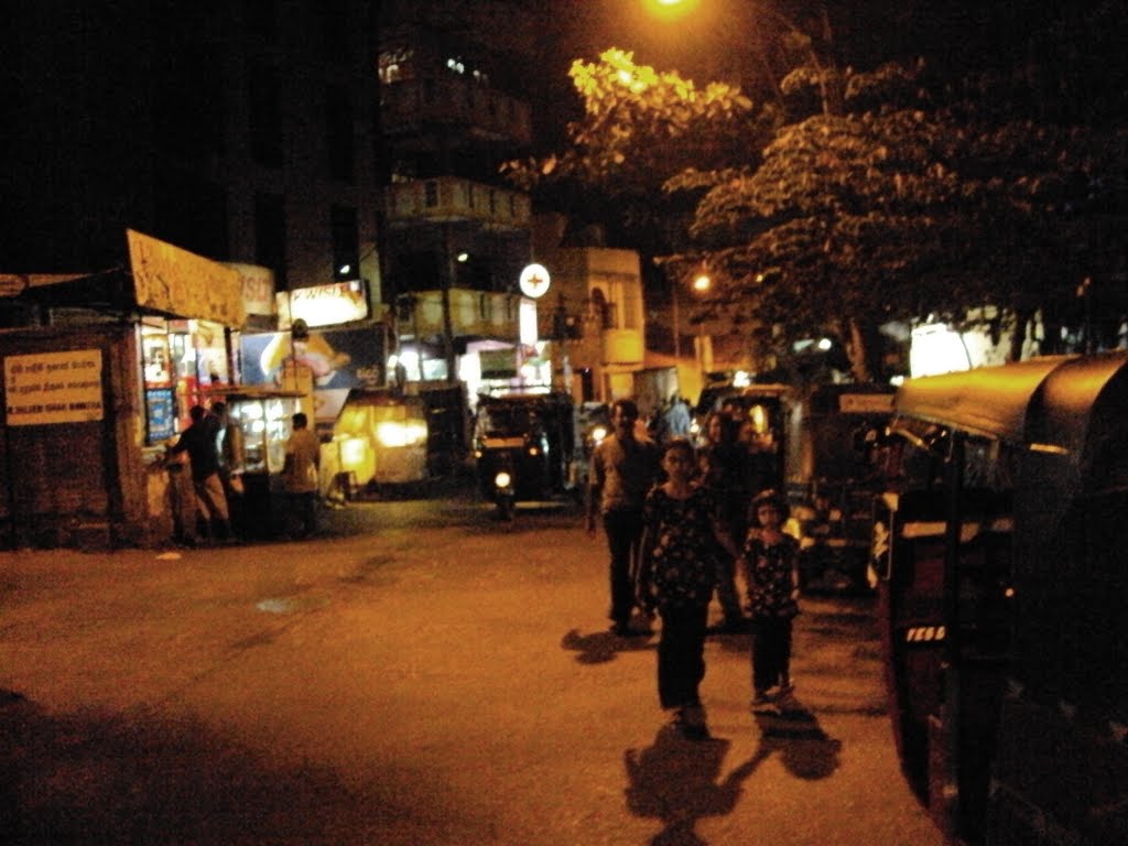 Street in Colombo at night by subodhi