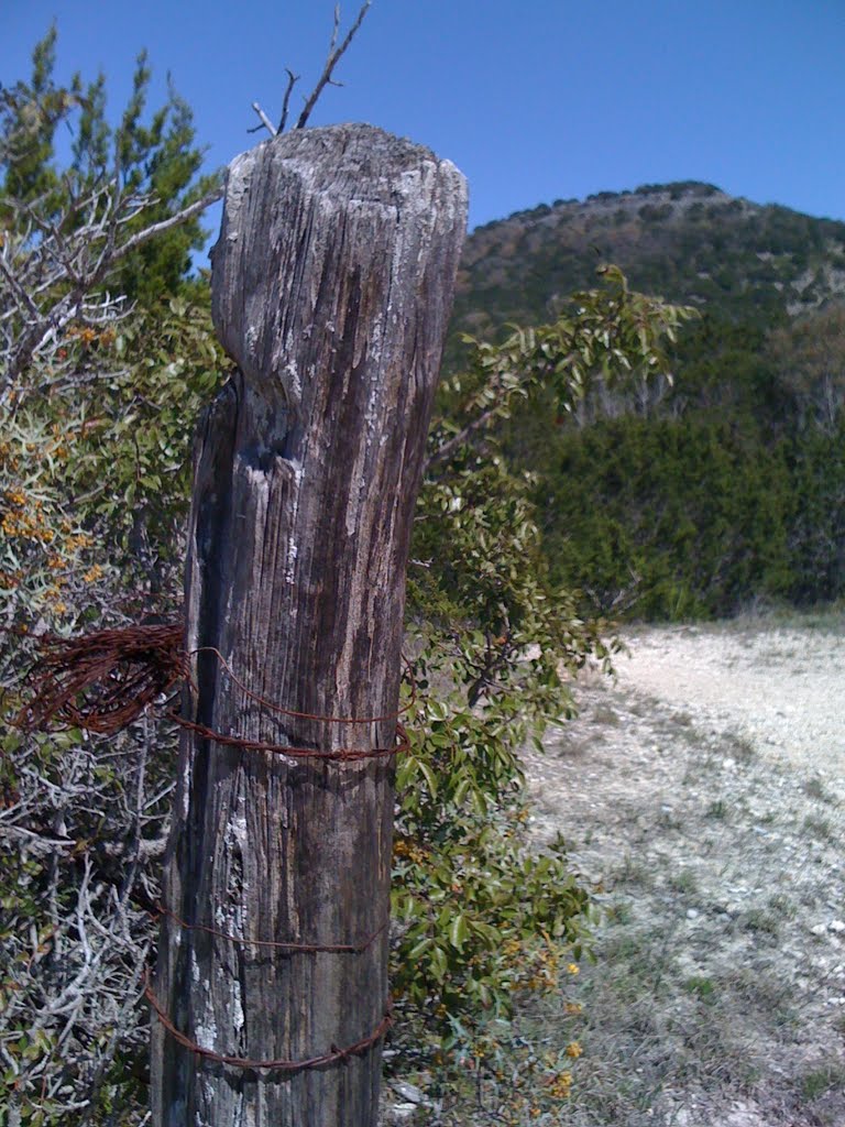 Old Fence Post with West Peak in the Background by jgrizzelle