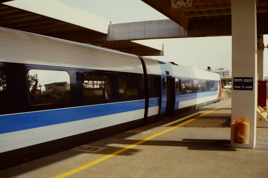 Tel-Aviv train station - The train to Haifa is ready to leave by Joe Cost Budde