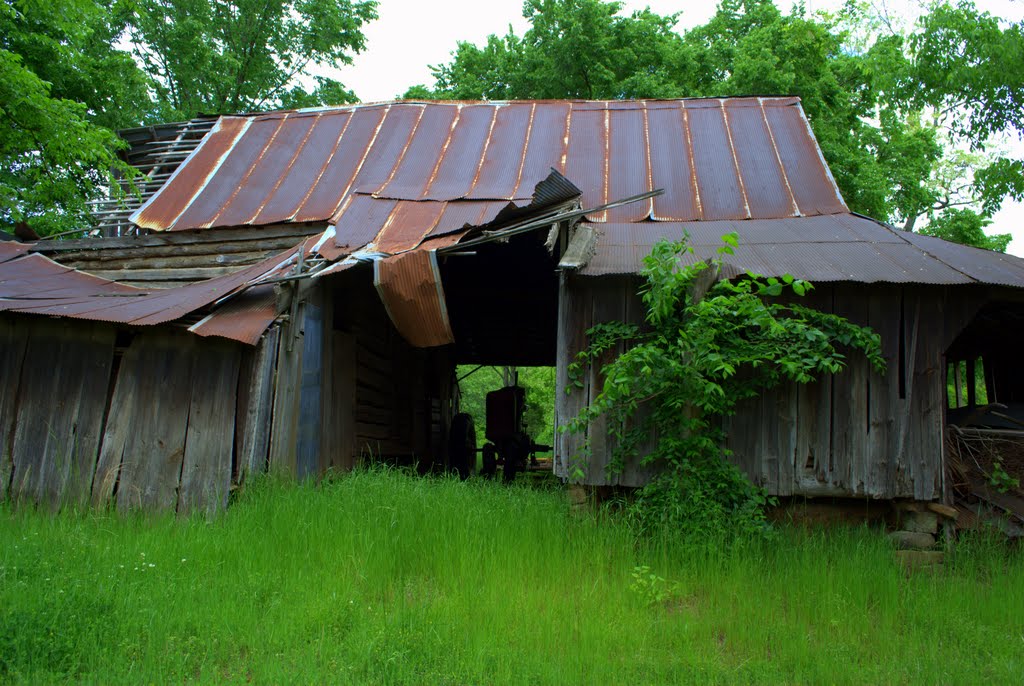 Old Tractor in an Old Barn by Brooks Family