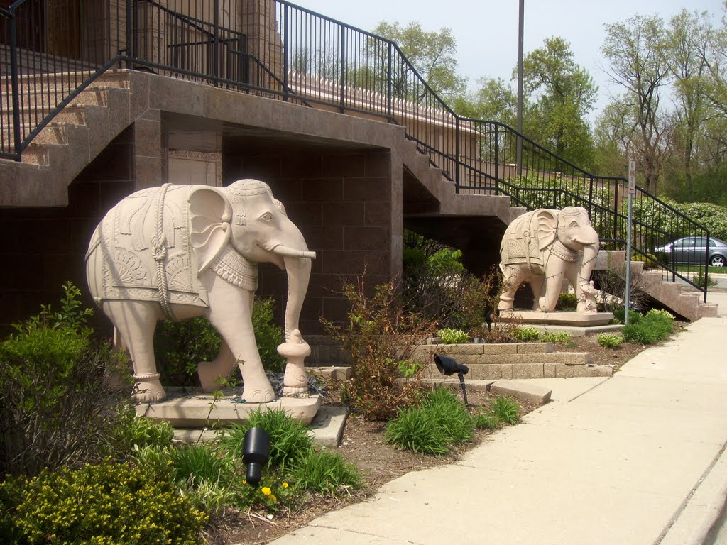 Two carved stone elephants at base of Temple entrance by germitian