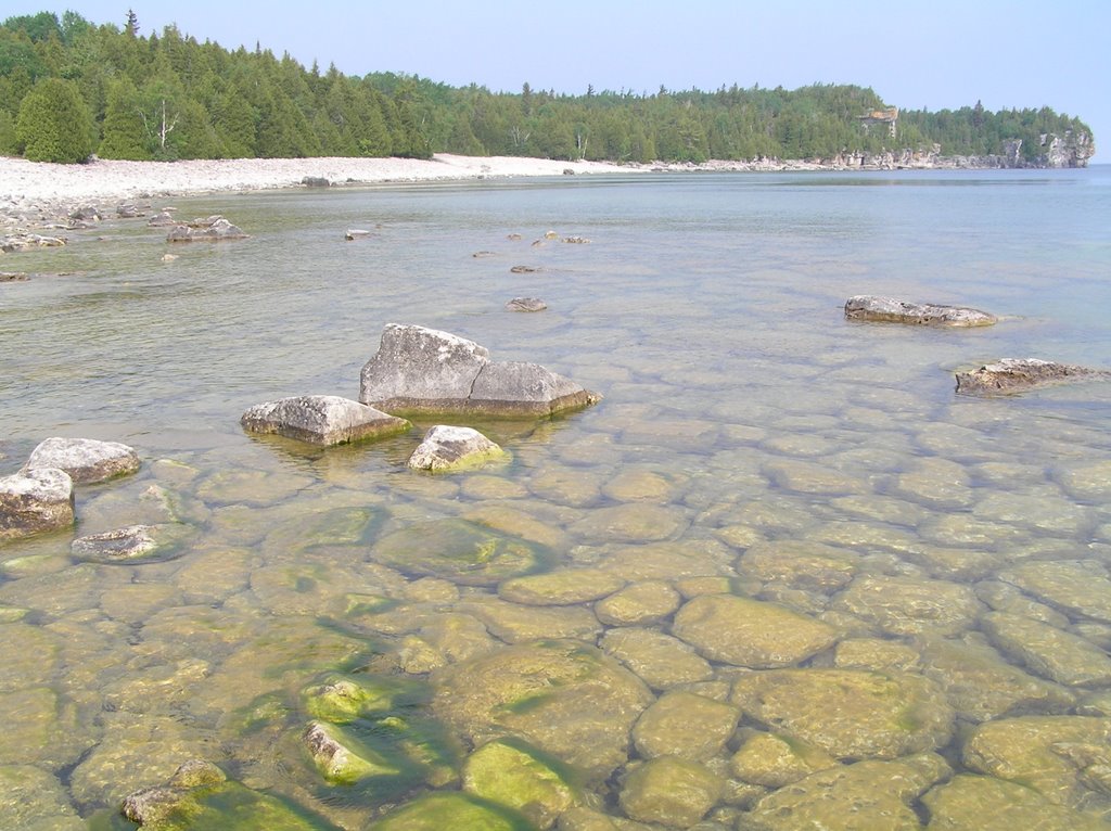 By the water, just past the large cobblestone beach by Boris Gjenero