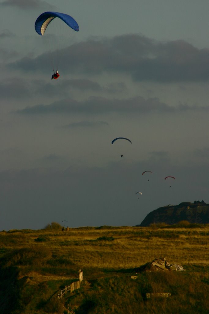 Paragliding over the Cliff by Olivier Sachet