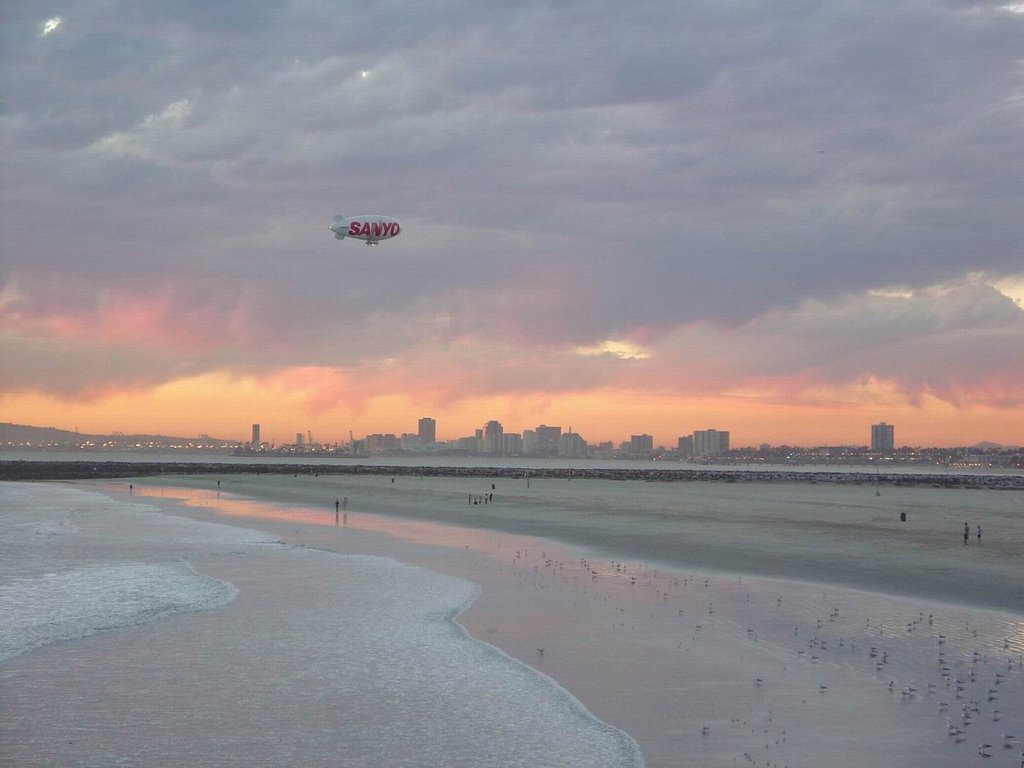 Sunset at Seal Beach, California. City of Long Beach, in background. by waltphoto