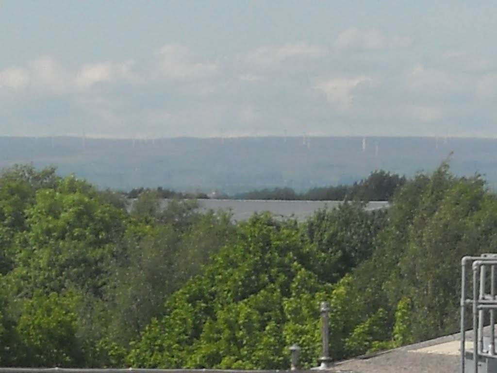 Scout Moor Wind Farm from Bredbury railway station by WythenshaweMike