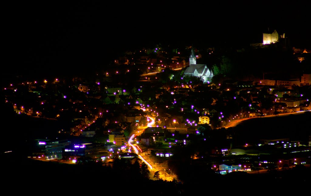 View of central Balzers, Liechtenstein, from the northeast. Taken from 4 miles (6.5km) away on Sennwis, in Triesenberg. Pfarrkirche St. Niklaus, right, Burg Gutenberg, far right. Liechtenstein. by John Schwenkler