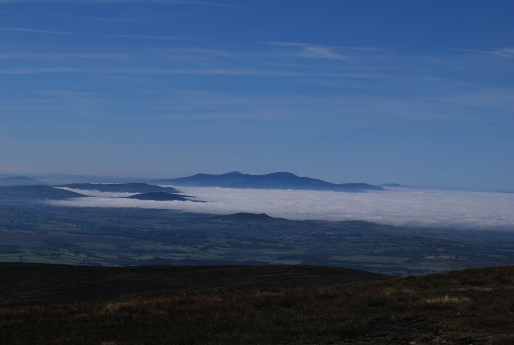 View from top of Lugnaquilla towards Mts in West sticking out of clouds by ucampbell