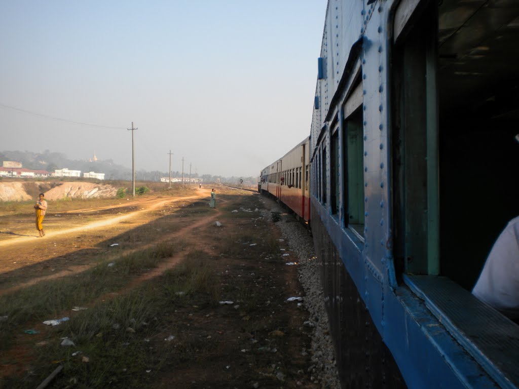 Train leaving Mawlamyine Station by Olivier Vuigner