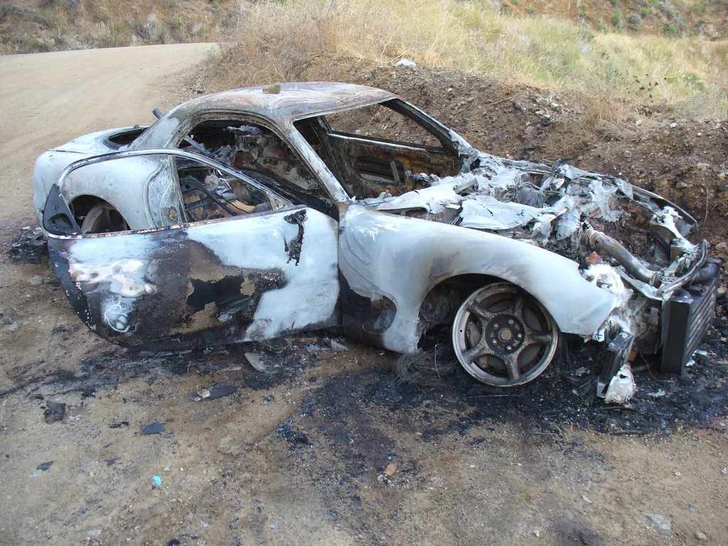 Burned car at Nacimiento Fergusson Road by Martin Stehr