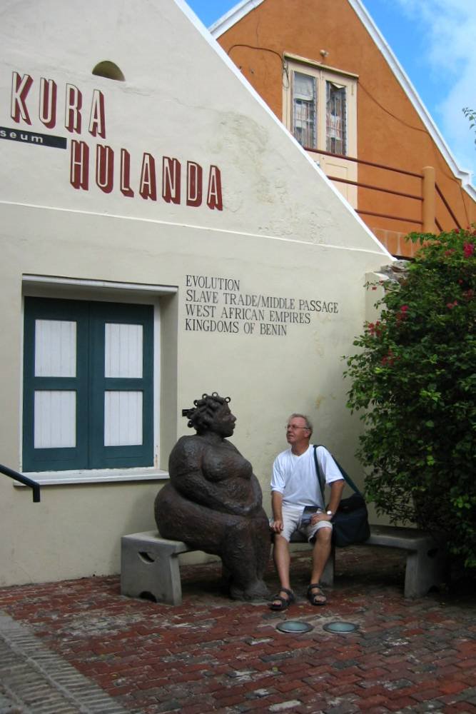 Chatting at Museum Kura Hulanda by Hans van der Aalst