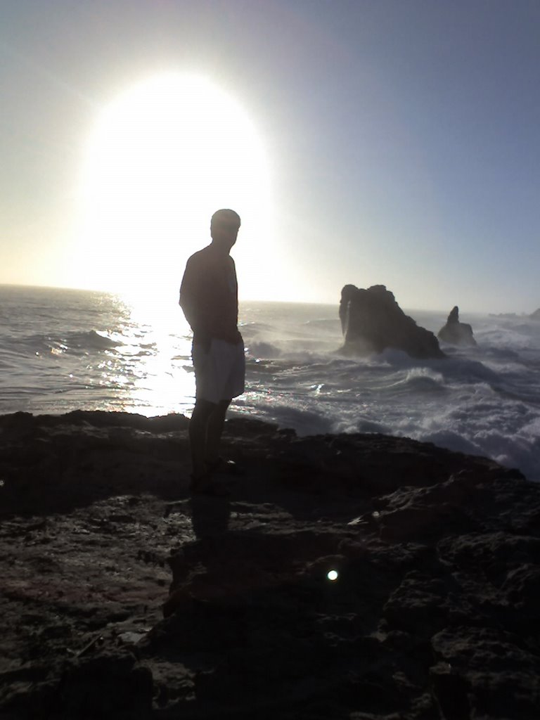 Silhouetted by the morning sun- Cleopatra baths in the background by Hisham Hilal