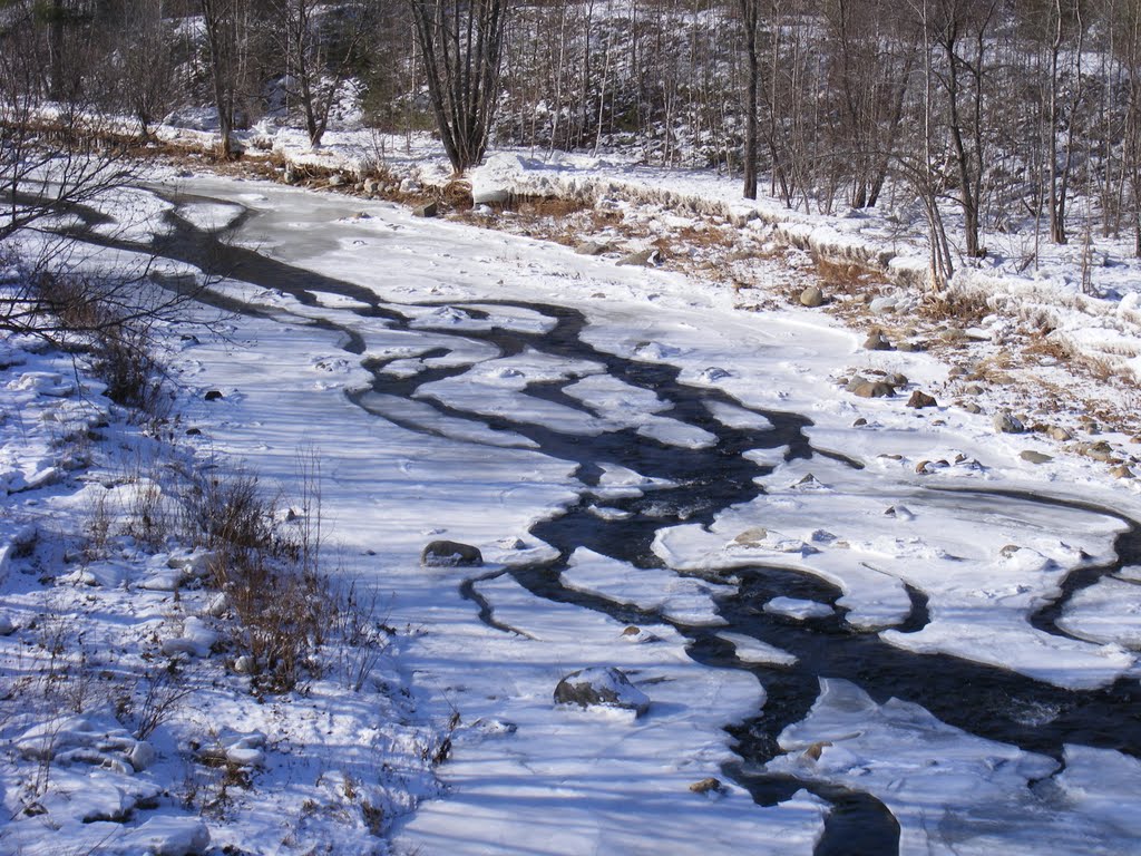 Water trying to get down an ice clogged river by JBTHEMILKER