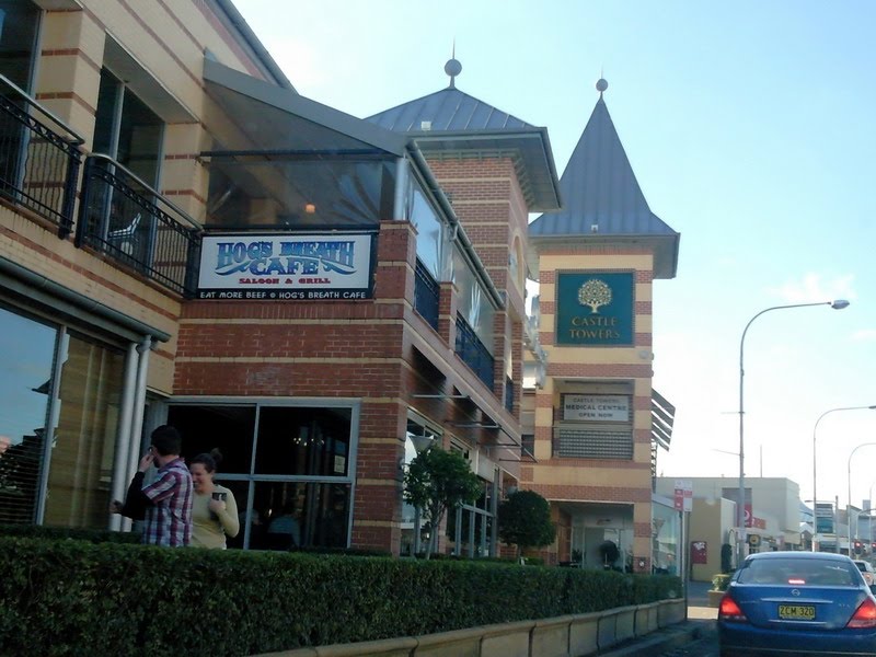 Shops of Castle Towers by the road by David Bennell