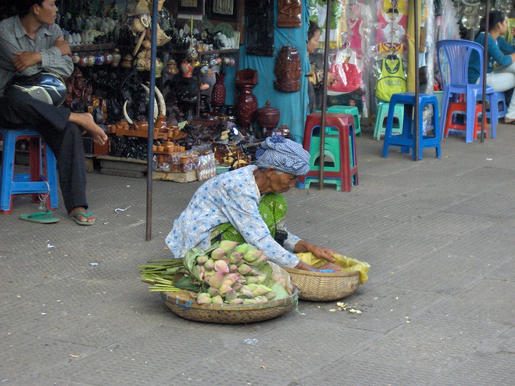 Street vendor in marketplace, Phnom Penh, Cambodia by phuatientim