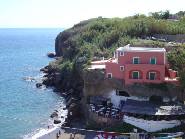 House and restaurant fronting the sea by Eric Pitisi